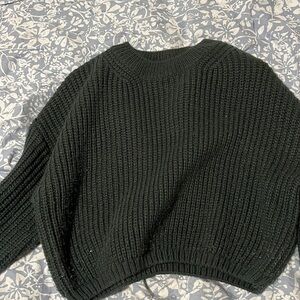 green knitted top